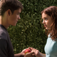 Jonas (Brenton Thwaites) shares an apple with Fiona (Odeya Rush) in 2014's The Giver.